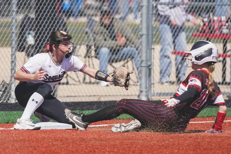 Yorkville's Isla Eidsness (right), slides into third for a triple again Antioch during a nonconference softball game at Yorkville High School on Saturday, April 12, 2025.