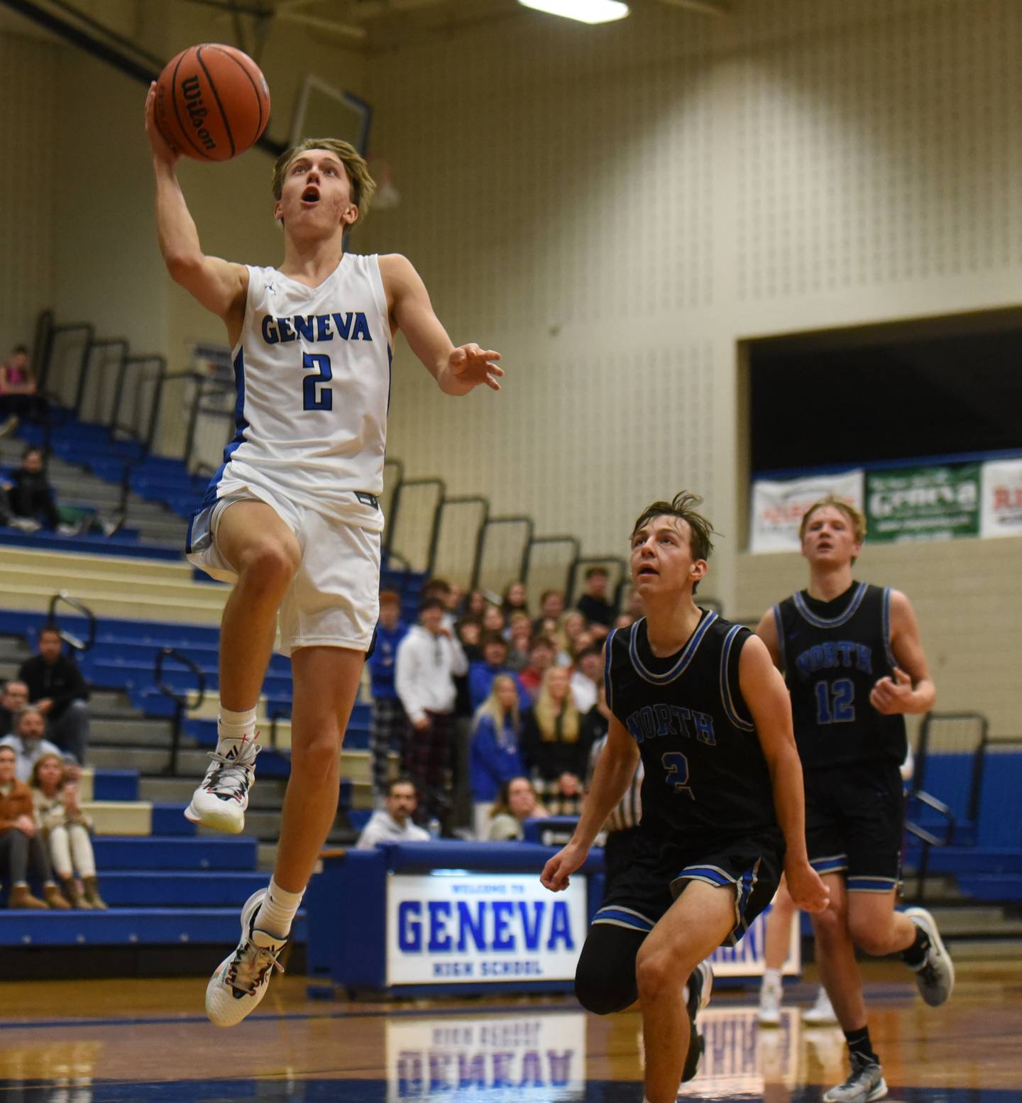 Joe Lewnard/jlewnard@dailyherald.com
Geneva’s Michael Lawrence scores on a breakaway ahead of St. Charles North’s Mason Siegfried, middle, and Parker Reinke during Saturday’s game in Geneva.