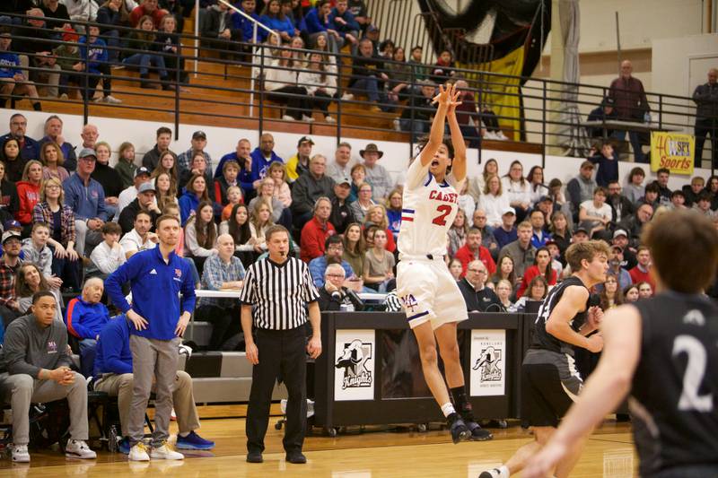 Marmion Academy's Jabe Haith shoots a three pointer to end the third quarter against Kaneland at the Class 3A Regional Final at Kaneland on Saturday, Feb.25, 2023.