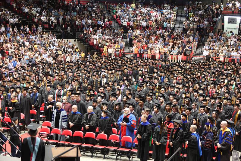 A sea of graduation candidates line the floor of the Convocation Center Saturday, May 14, 2022, during the first of two undergraduate commencement ceremonies at Northern Illinois University in DeKalb.