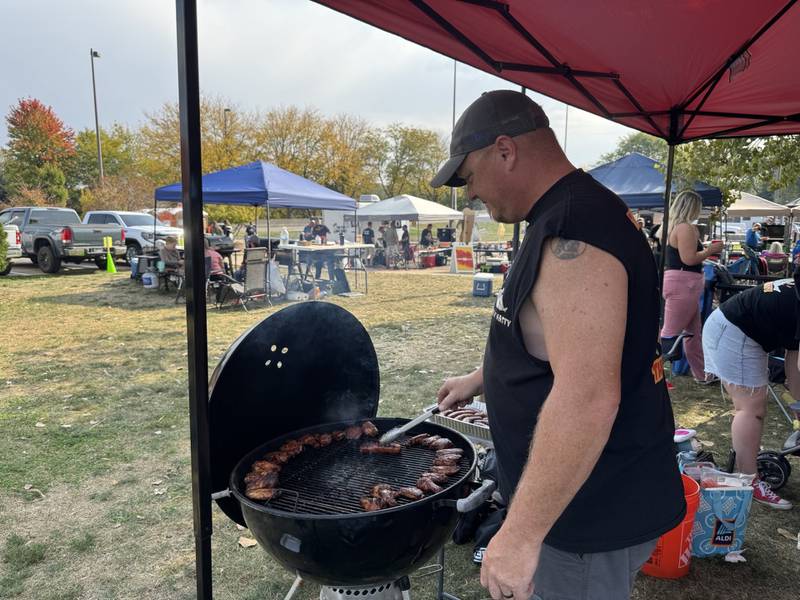 Matt Roop, of Sandwich, grills during Smoketober Fest on Saturday Oct. 12, 2004 at the Jordan Block in Ottawa.