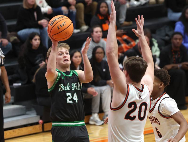 Rock Falls' Owen Mandrell shoots over DeKalb's Lukas Stubblefield during their game Tuesday, Dec. 2, 2025, at DeKalb High School.