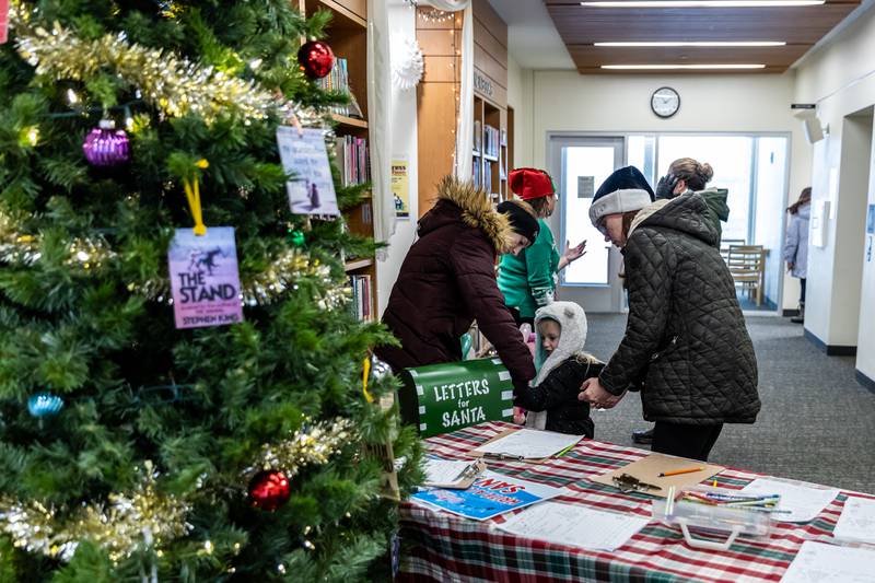 Attendees drop off letters to Santa at the White Oak Library District’s Lockport Branch during Lockport’s Christmas in the Square festivities on Nov. 29, 2025.