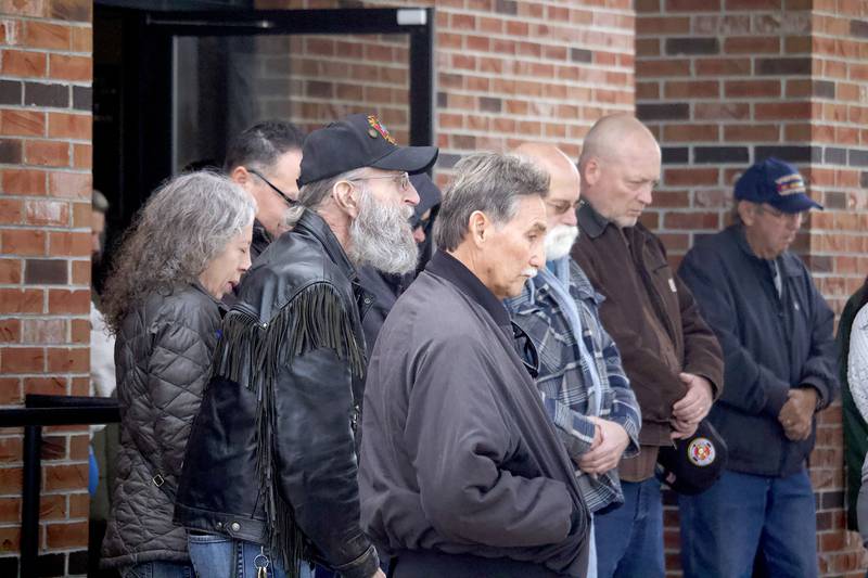 Attendees take a moment of silence during a flag ceremony on Veterans Day at the Stone City VFW Post 2199, 124 Stone City Drive, Joliet, on Tuesday, Nov. 11, 2025.