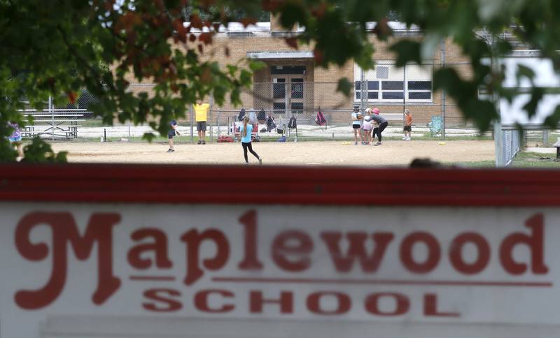 Children practice on a ball field at Maplewood Elementary School on Wednesday, Sept. 6, 2023. Members of the Cary School District 26 Board of Education voted on a transportation project site design concept and project timeline that paves the way for Maplewood Elementary School to be tore down and the construction of new and larger transportation center.