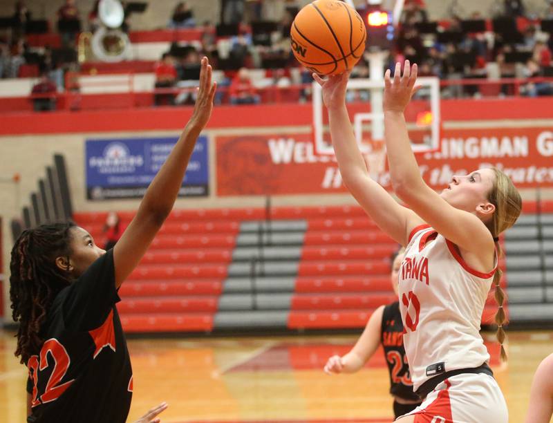 Ottawa's Ella Schmitz lets go of a shot in the lane over Sandwich's Alaya Harris on Monday, Jan. 27, 2025 in Kingman Gym at Ottawa High School.