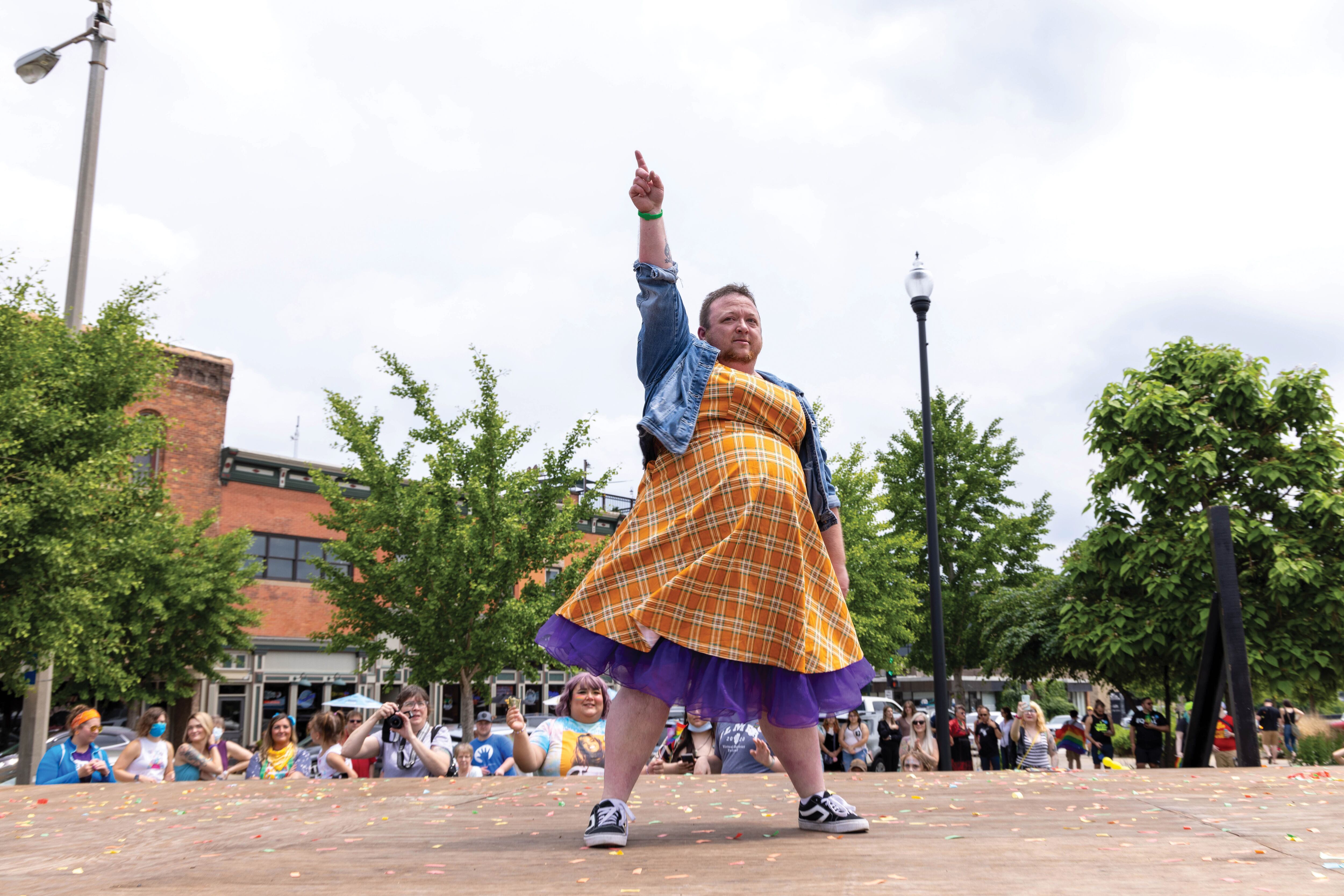 Ottawa Family Pride Festival organizer Dylan Conmy delivers a fundraising lip sync performance on the Jordan Block stage in downtown Ottawa during the inaugural festival in June 2022. 