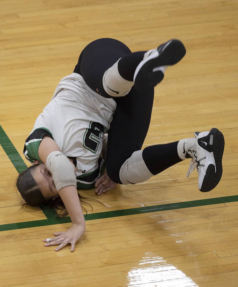 Rock Falls’ Isela Valdivia rolls over after saving a ball  against Erie-Prophetstown Thursday, Sept. 11, 2025.