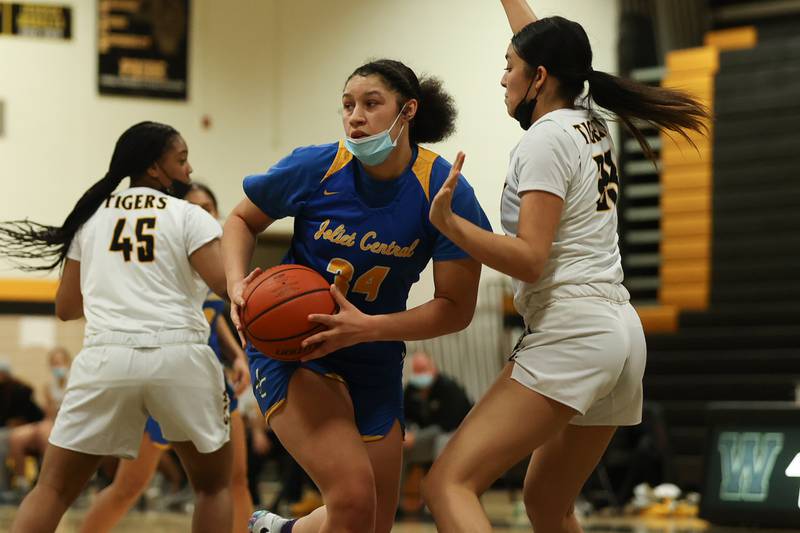 Joliet Central’s Nylah Davis looks to pass against Joliet West. Tuesday, Feb. 8, 2022, in Joliet.