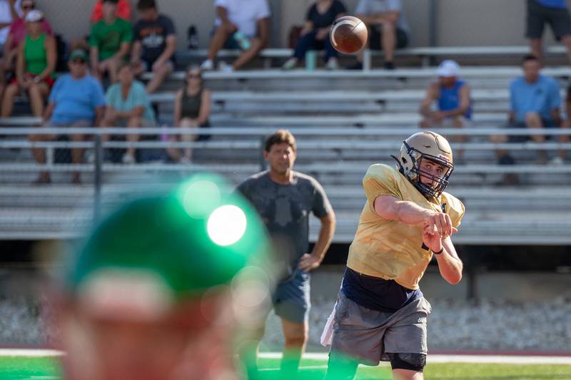 Anthony Couch of Marquette throws football during scrimmage on Tuesday July 16, 2025 at Howard Fellows Stadium in LaSalle.