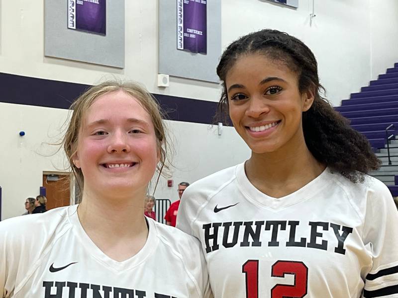 Huntley's Lizzy Williams (left) and Morgan Jones helped lead the Red Raiders to a 25-4, 25-23 Fox Valley Conference win on Tuesday in Hampshire.