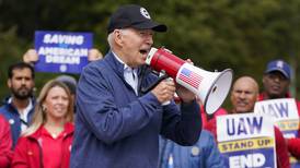 Biden urges striking auto workers to ‘stick with it’ in picket line visit unparalleled in history