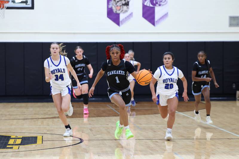 Kankakee's Ki'Asia Wilson breaks away with the ball during the Kays' 75-28 victory over Rosary at the Reed-Custer Classic on Monday, Nov. 17, 2025.