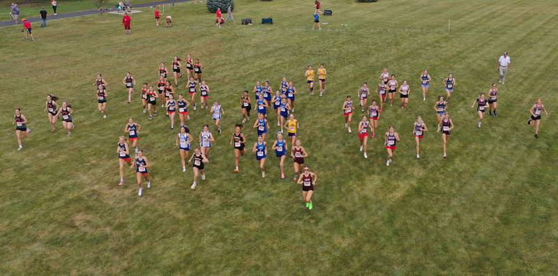 An aerial view of the varsity girls race as it kicks off during the Gary Coates Invitational cross country meet on Saturday, Sept. 13, 2025 at Zearing Park in Princeton .