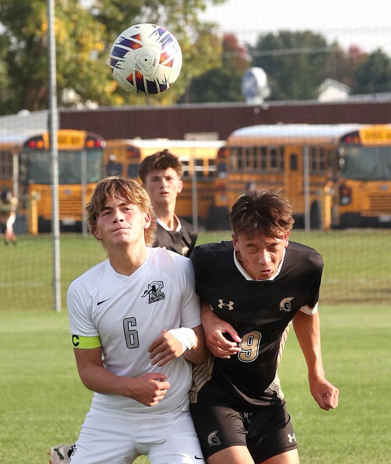 Kaneland's Noah McKittrick (left) and Sycamore's Felix Arends head a ball during their game Wednesday, Sept. 18, 2024, at Sycamore High School.