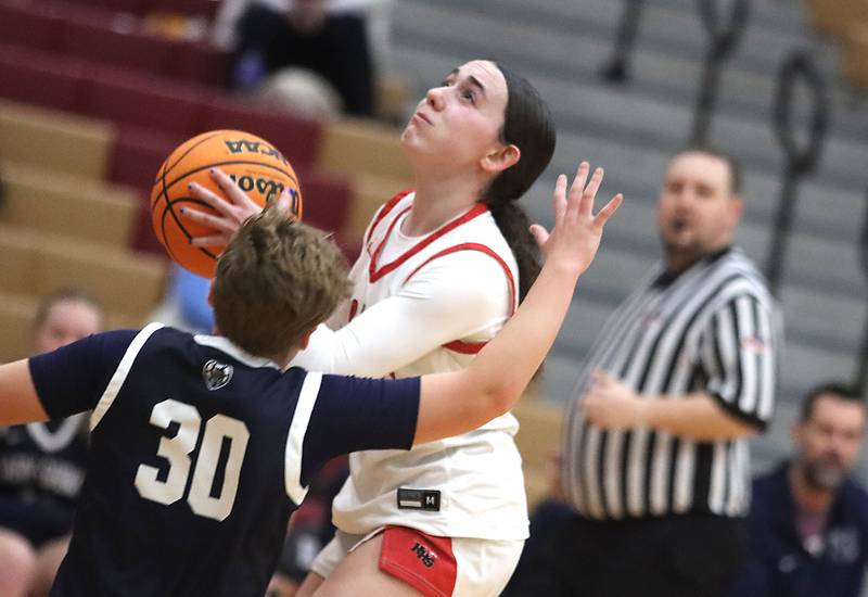 Huntley’s Luca Garlin works under the hoop against Cary-Grove in varsity girls basketball on Monday, Feb. 2, 2026, at Huntley High School in Huntley.