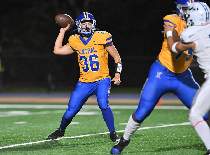 Joliet Central's Jeffrey Grimes (36) passing the ball during the conference game against Plainfield South on Friday, OCT. 17, 2025, at Joliet.