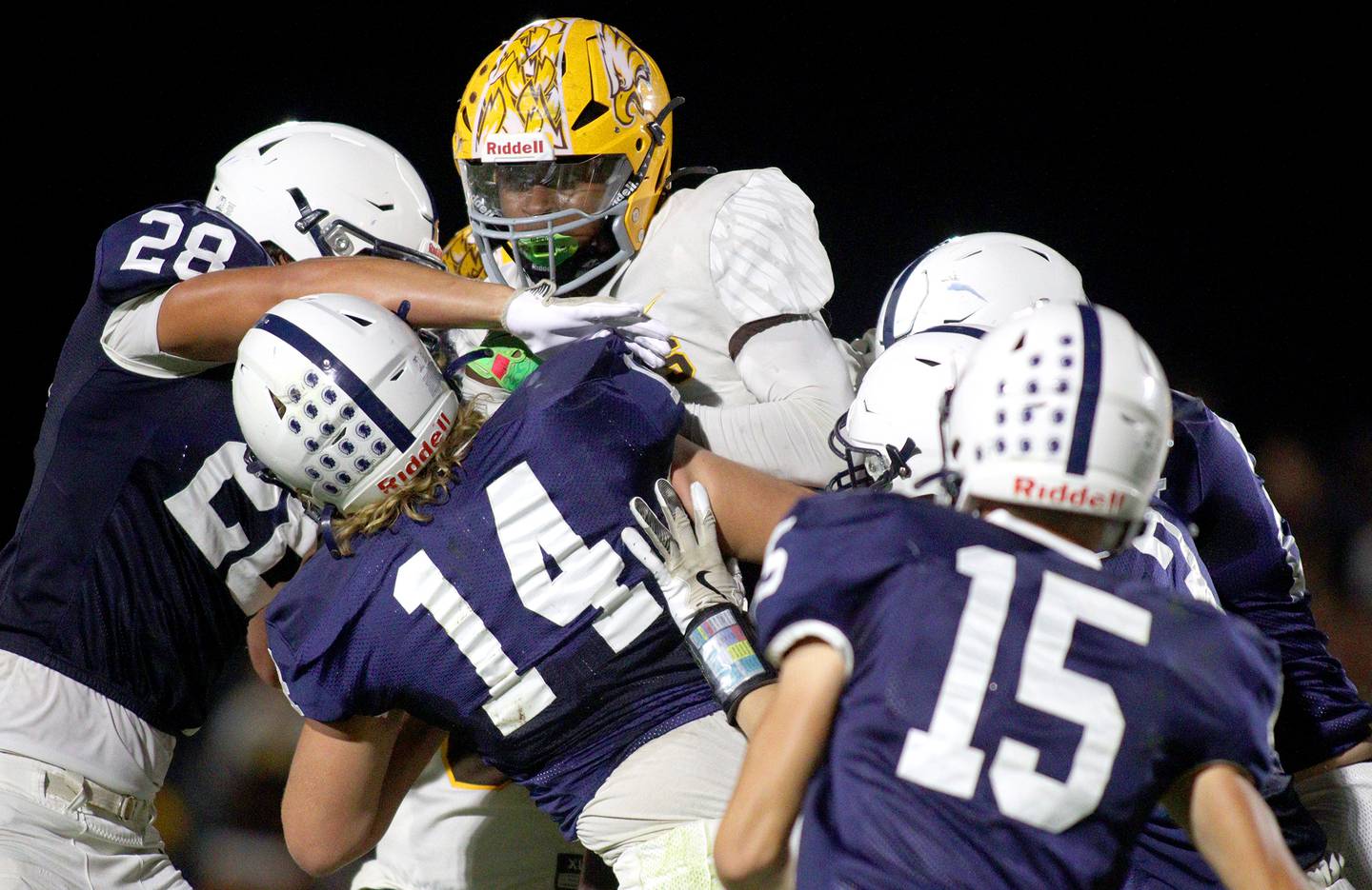 Cary-Grove’s defense swarms Jacobs’ T.O. Boddie in varsity football on Friday, Sept. 20, 2024, at Al Bohrer Field on the campus of Cary-Grove High School in Cary.