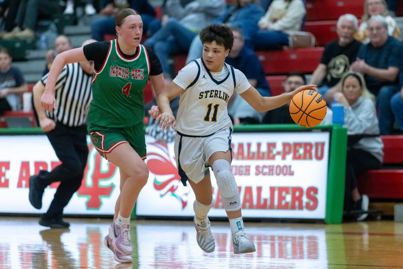 Joslynn James of Sterling High School works her way around LP's Alexus Hines during the IHSA Class 3A Girls Basketball Regionals in Sellett Gym on February 6, 2026 at LaSalle-Peru High School.