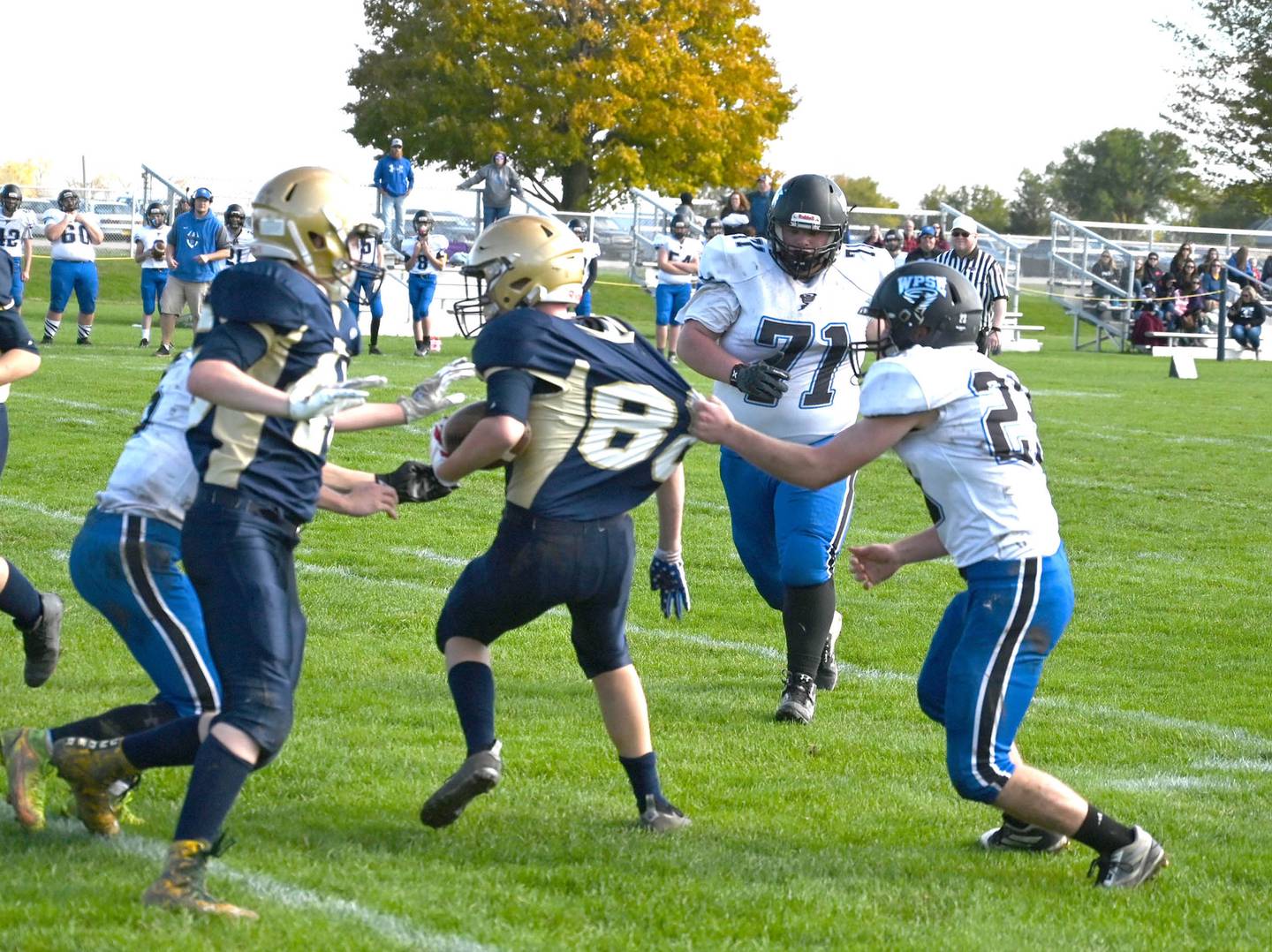 Polo's Nathaniel Yingling run is halted after a West Prairie defender grabs a handful of jersey in the first half of their 8-man football playoff game Saturday afternoon.