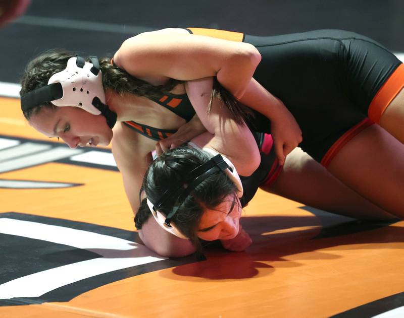 DeKalb’s Frieda Hernandez works to turn Kaneland’s Marwa Ammeri during their 115 pound match Wednesday, Jan. 7, 2026, at DeKalb High School.