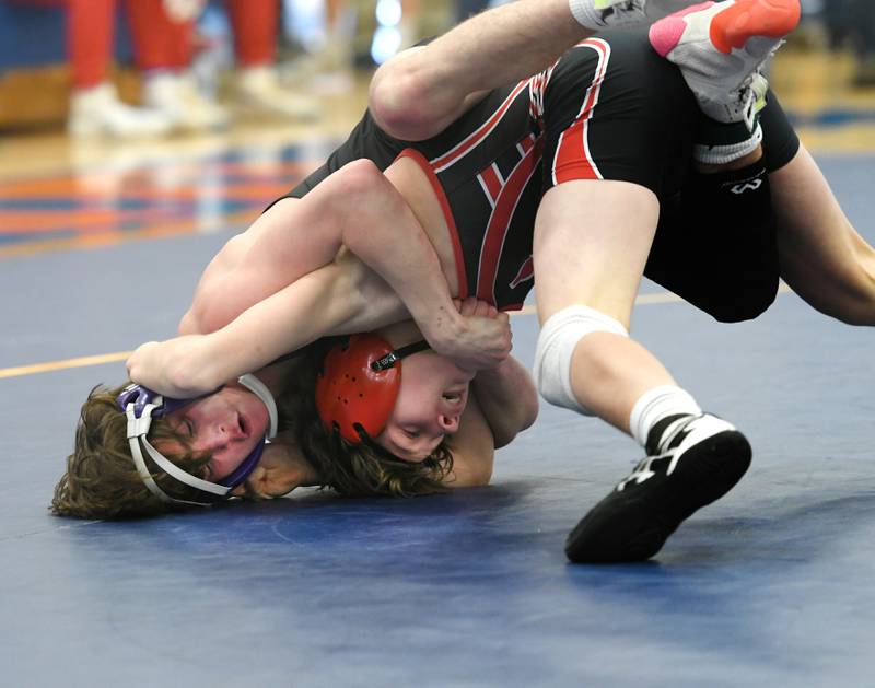 Dixon's Ayden Rowley (left) wrestles Amboy's Landon Blanton for the 113-pound championship at the 1A Polo Wrestling Regional held at Eastland High School in Lanark on Saturday, Feb. 4.