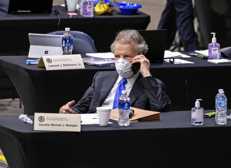 Illinois Speaker of the House Michael Madigan, D-Chicago, talks on his cellphone from his desk during an extended session of the Illinois House of Representatives at the Bank of Springfield Center, Saturday, May 23, 2020, in Springfield, Ill. The Illinois House of Representatives is holding session at the Bank of Springfield Center instead of the Illinois State Capitol because it allows for safe social distancing amid the coronavirus pandemic. (Justin L. Fowler/The State Journal-Register via AP, Pool)