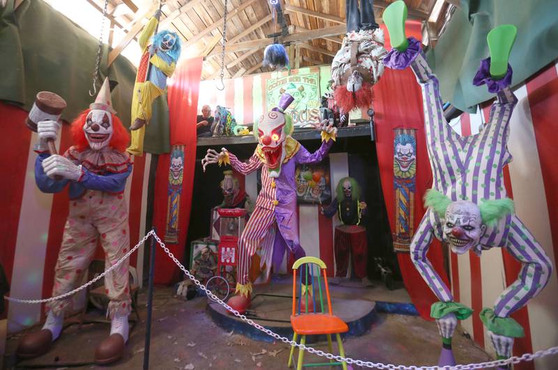 Jeff Gilbert (top left) works on a animatronics high above the clown room inside the Nightmare on Fairgrounds Road Haunted Attraction on Monday, Sept. 29, 2025 at the Bureau County Fairgrounds in Princeton. Every year, the old, creepy, barns at the Bureau County Fairgrounds are transformed into the stuff of nightmares. The Nightmare on Fairgrounds Road is in it’s 22nd year. This year’s event features: haunted barns, bonfire, and souvenirs. The popular haunted house is open Friday's and Saturday's from 7p.m.-10p.m. at the Bureau County Fairgrounds in Princeton. Admission is $20 for kids age 8 and older.