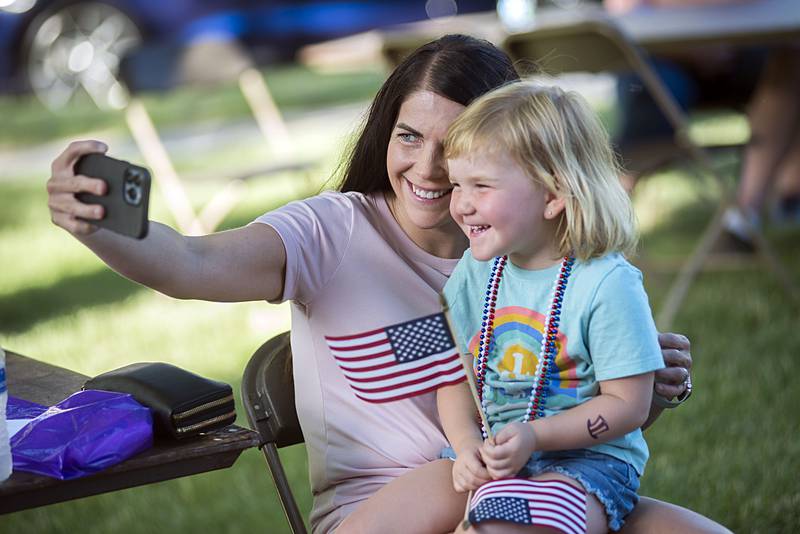 Tiffany Bowser snaps a selfie with daughter Taylor Hadaway, 4, as they two enjoy some fun time Friday, July 1, 2022 at the Petunia Fest ice cream social.