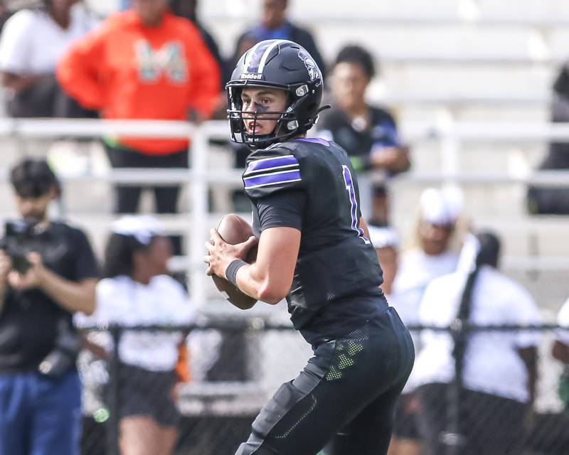 Downers Grove North's Baker Glomb (32) celebrates his field goal to win their football game at Morgan Park Saturday, Aug 30, 2025  in Chicago.