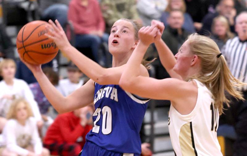 Geneva's Caroline Madden goes to the basket against Sycamore’s Lexi Carlsen during their game Monday, Nov. 14, 2022, at Sycamore High School.