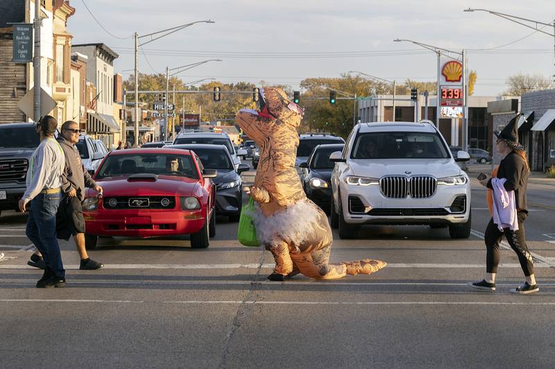 Why did the Tyrannosaurus cross the road? To beat his eventual ancestor as seen Friday, Oct. 25, 2024, in Rock Falls.