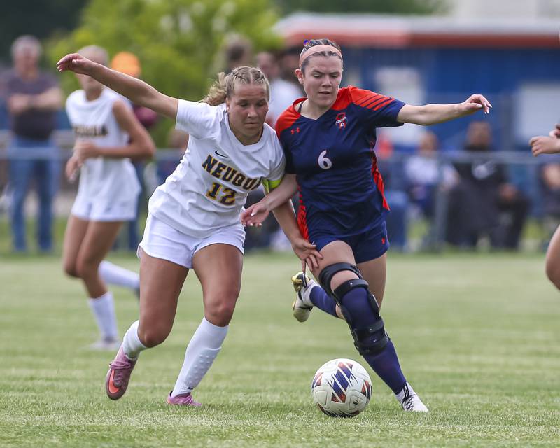 Oswego's Olivia Giles (6) fends off Neuqua Valley's Addison Guskey (12) during Class 3A regional final soccer match between Neuqua Valley at Oswego on Saturday, May 23, 2026 in Oswego.