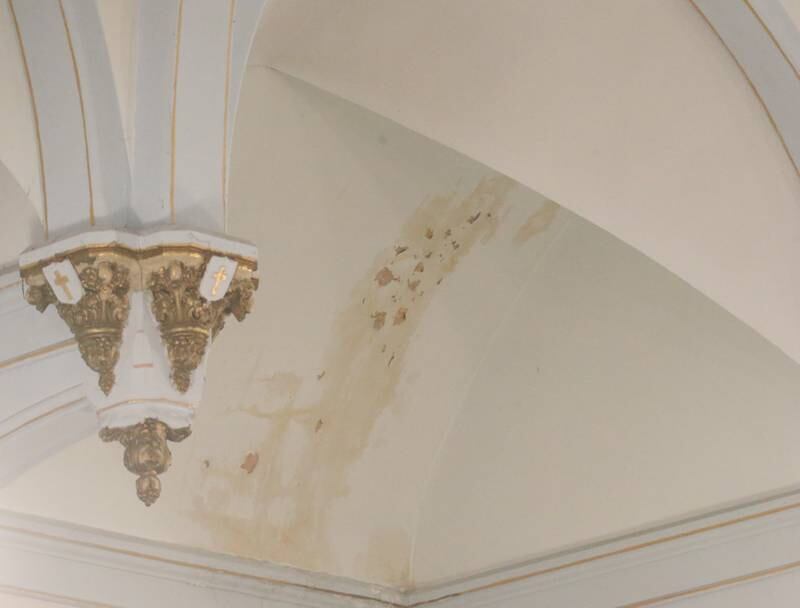 A stained ceiling and chipped paint are noticeable on the celing during the final Mass at St. Mary's Church on Thursday, Aug. 15, 2024 in Peru. The church was founded in 1867.