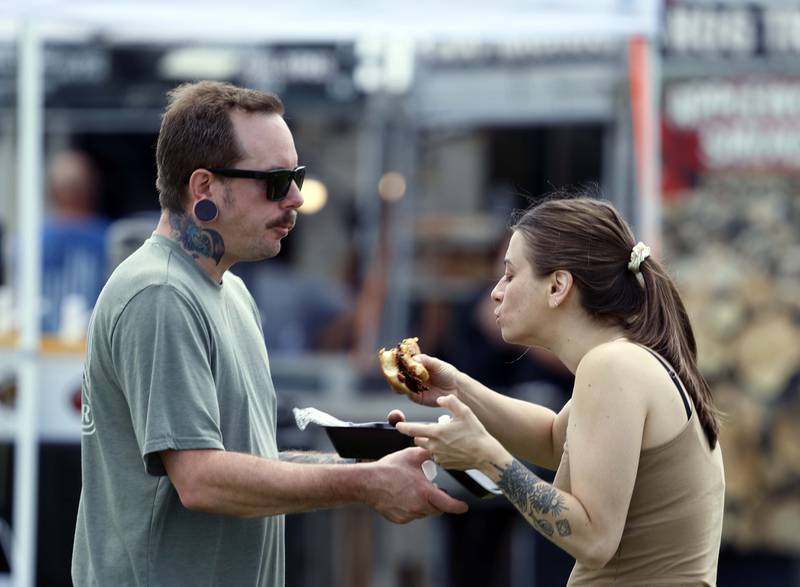 Nikko and Katie Faciano of Crystal Lake share a brisket sandwich during Lake in the Hills Rockin’ Rotary Ribfest Saturday, July 12, 2025 in Lake in the Hills.
