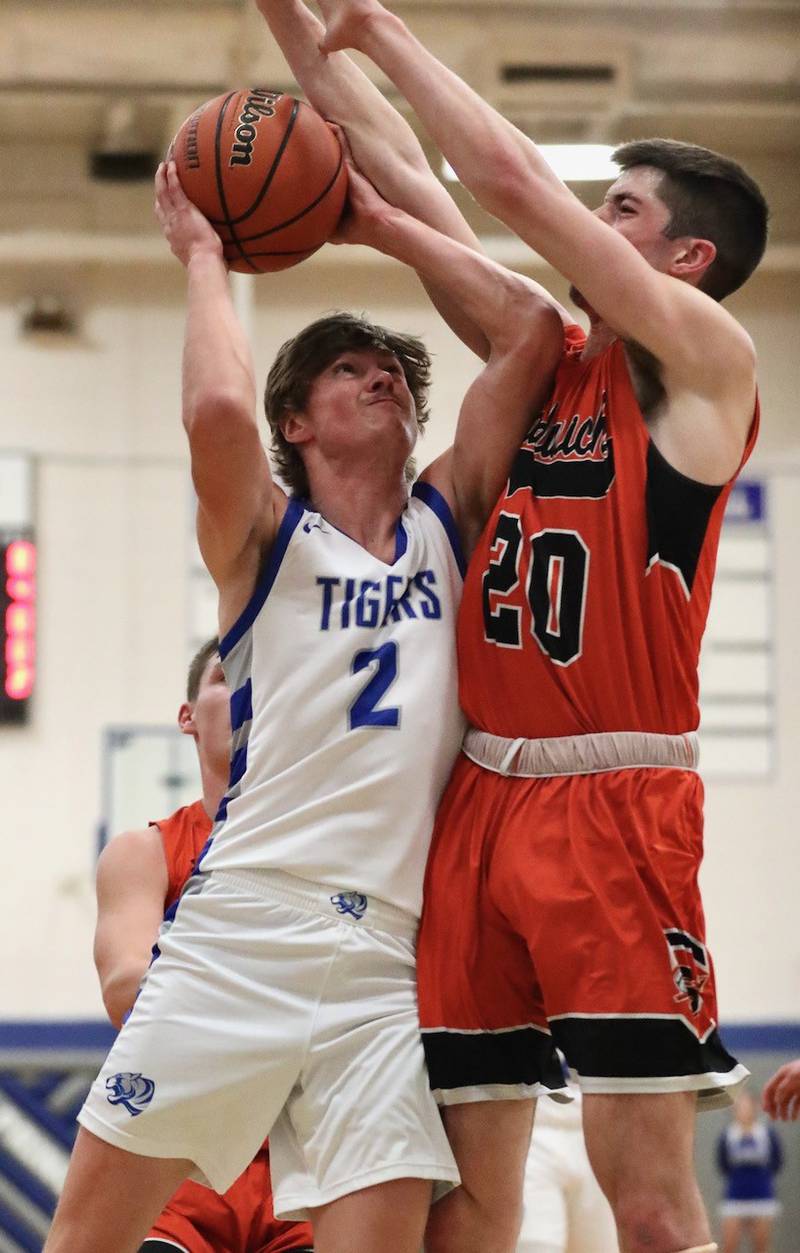 Princeton's Teegan Davis shoots against Sandwich's Owen Sheley Tuesday at Prouty Gym. The Tigers won 60-43.
