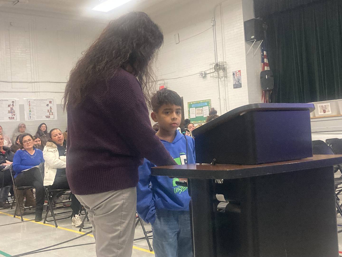 Marshall Elementary student Daniel Gonzalez speaks to the District 86 school board with the assistance of translator Florina Vidana.
Wednesday, Feb. 4, 2026.