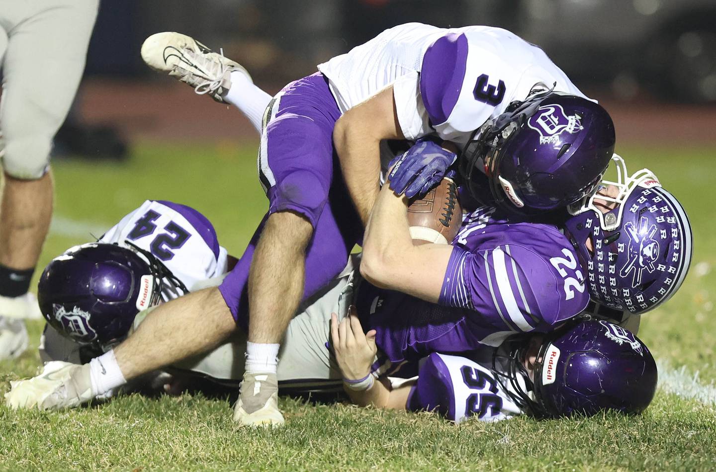 Dixon’s Gavin Jensen, Hunter Vacek and Ryan Ramsdell bring down Rochelle's Trey Taft during their first round playoff game Friday, Oct. 28, 2022, at Rochelle High School.