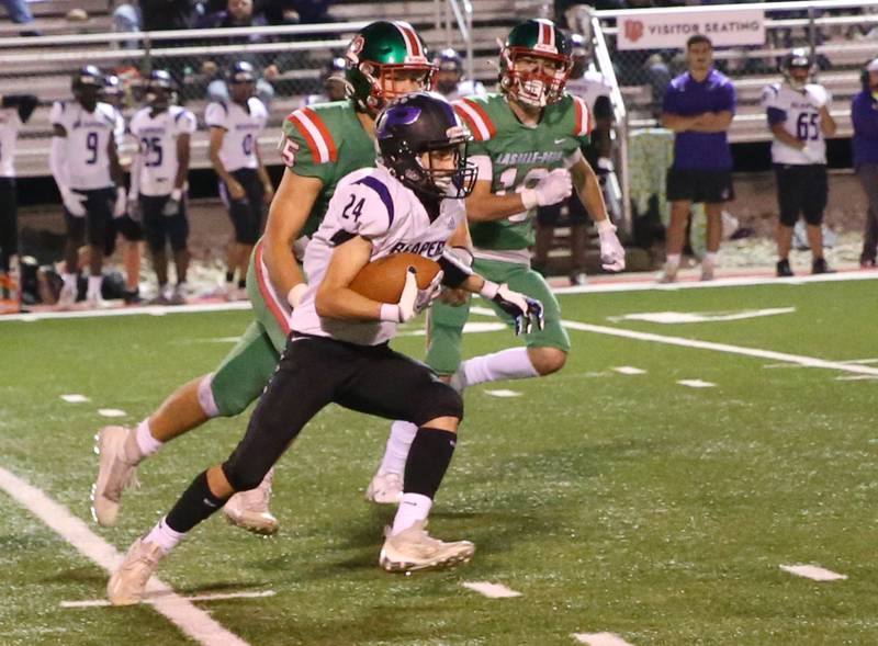 Plano's Tristan Meszaros sprints down the field as L-P defenders chase after him on Friday, Sept. 15, 2023 at Howard Fellows Stadium.