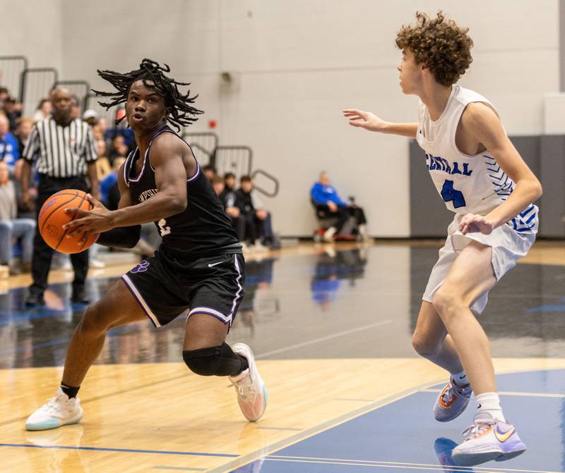 Hampshire point and shooting guard Daniel Luckett (2) drives the lane during a game at Burlington Central High School on Friday, Dec. 22, 2023.
