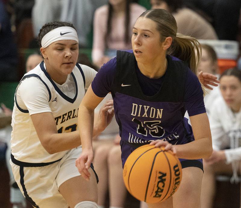 Dixon's Morgan Hargrove handles the ball against Sterling’s Joslynn James Thursday, Feb. 27, 2025, during the Class 3A girls Sectional title at Rockford Boylan High School.