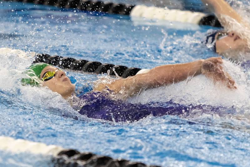 Dundee-Crown’s Rachel Johnson competes in the 100 Yard Backstroke during the IHSA Girls State Swimming Preliminaries at FMC Natatorium in Westmont on Nov. 14, 2025.