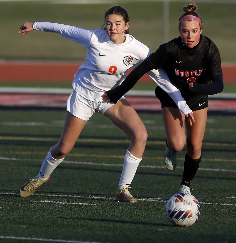 Crystal Lake Central's Avery Watson and Huntley's Sofia Bruns try to chase down the ball during a Fox Valley Conference  soccer match on Tuesday, April 15, 2025, at Huntley High School.