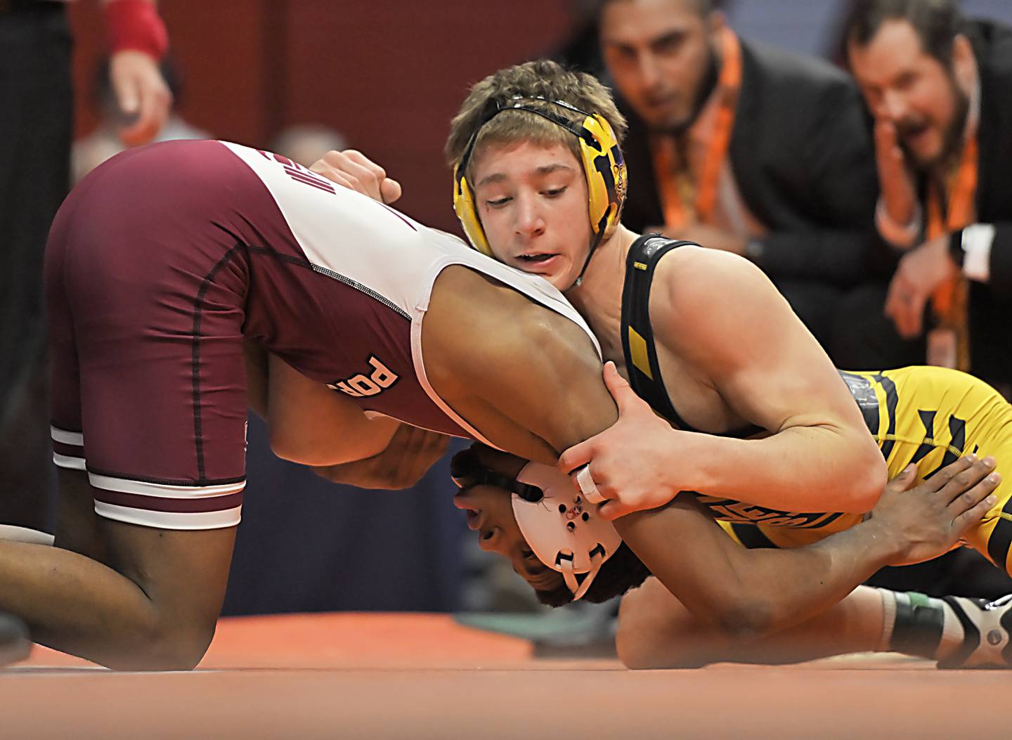 Joliet West's Carson Weber, top, and Lockport's Justin Wardlow wrestle in the Class 3A 150-pound final at the IHSA boys state wrestling championships at the State Farm Center in Champaign on Saturday, Feb. 22, 2025.