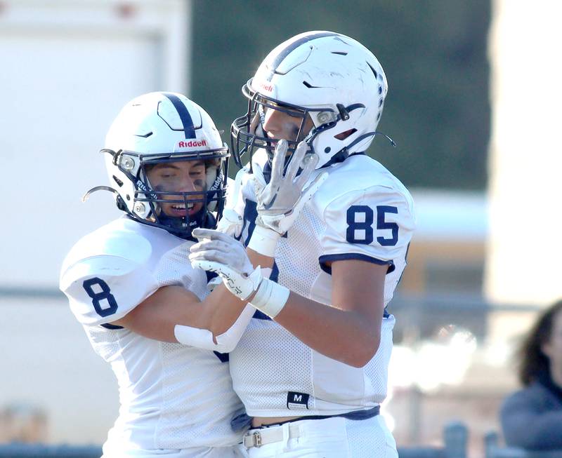 Cary-Grove’s Andrew Prio, left, and Luca Vivaldelli celebrate a Prio touchdown against Highland Park in second-round IHSA Class 6A playoff action at Wolters Field in Highland Park Saturday.