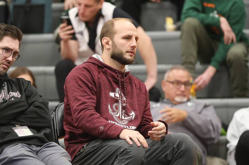 Lockport head coach Jameson Oster watches Lockport’s Justin Wardlow and Joliet Catholic’s Nolan Vogel in the Class 3A Minooka Regional 157 pound championship on Saturday, Jan. 31, 2026 in Minooka.
