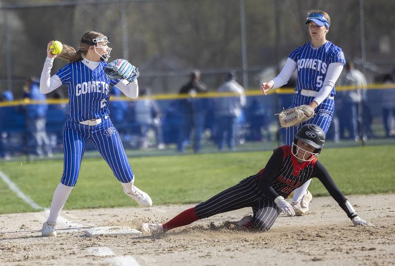 Newman’s Brenleigh Cook looks to throw after making an out at third base against Hall Monday, April, 21, 2025.