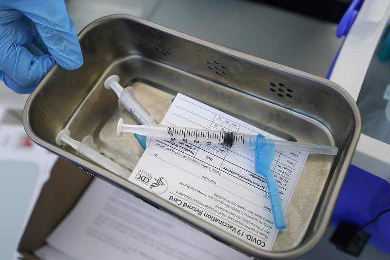 This May 13, 2021, file photo shows syringes filled with the Johnson & Johnson vaccine at a mobile vaccination site in Miami