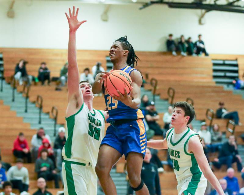 Lyon's Marshaun Russell (25) goes up to the rim during their basketball game between Lyons at York. Jan 10, 2025 in Elmhurst.