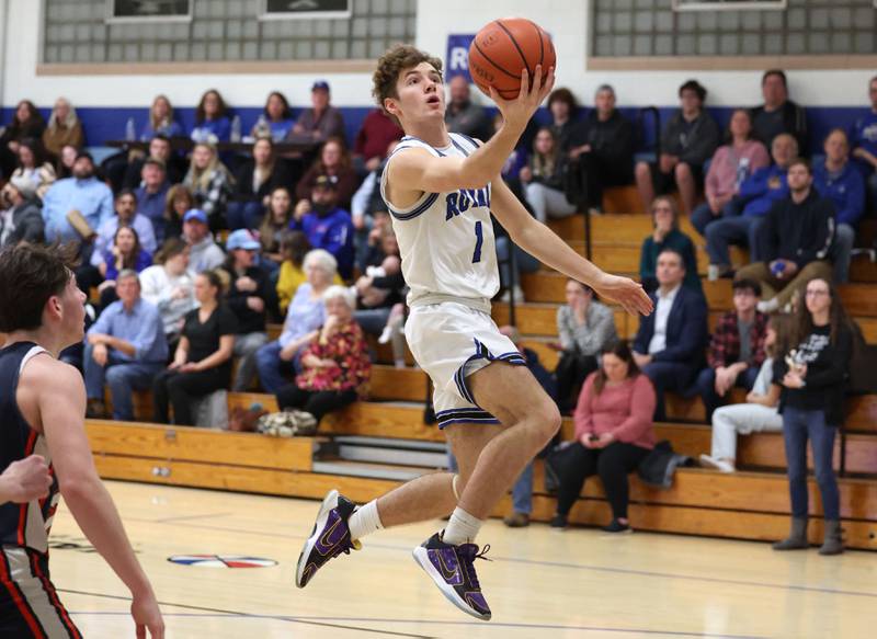 Hinckley-Big Rock's Tyler Smith gets past the DePue defense for a layup during their game Tuesday, Feb. 13, 2024, at Hinckley-Big Rock High School.